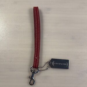 Coach Red Wristlet with Silver Clip and metal silver hangtag.